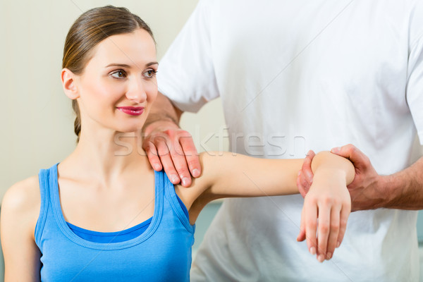 Patient at the physiotherapy doing physical therapy Stock photo © Kzenon