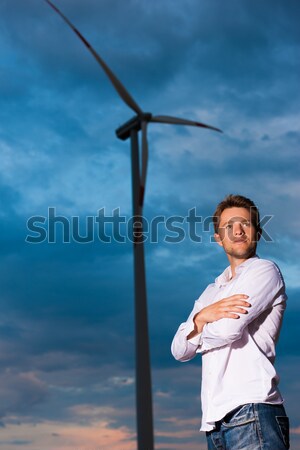 Stock photo: Woman in front of windmill and sky