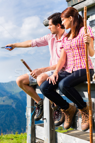 Alps - Man and woman sitting at cabin in tirol Stock photo © Kzenon
