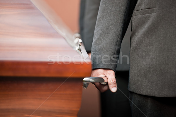 coffin bearer carrying casket at funeral Stock photo © Kzenon