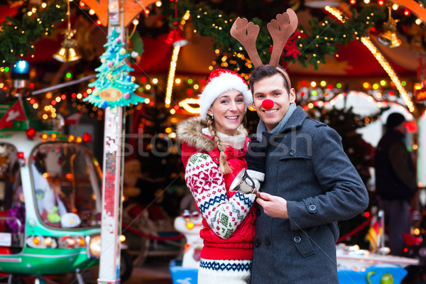 Stock photo: Couple on traditional Christmas market 