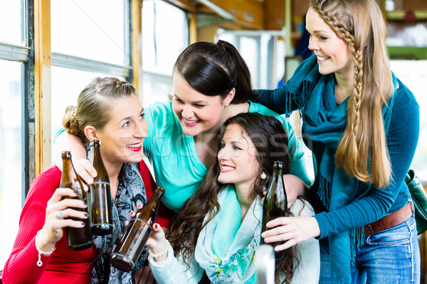 Stock photo: Group of people in tram bar having beer party