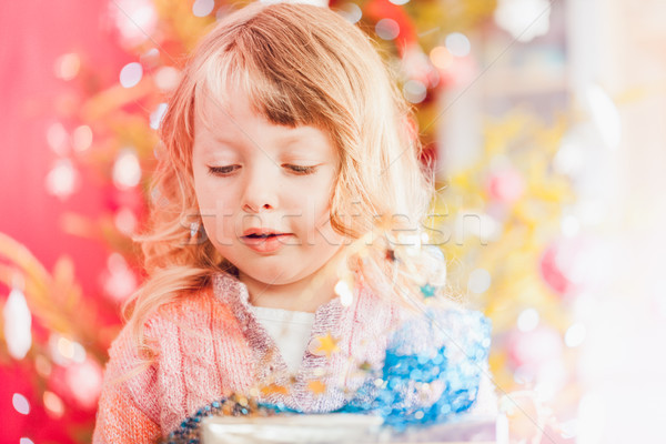 Christmas, happy little girl with Xmas present on Christmas Eve Stock photo © Kzenon