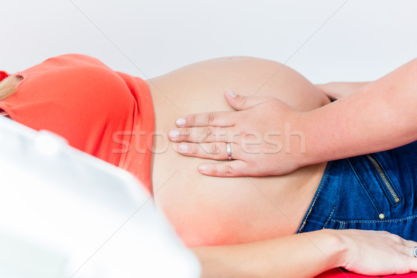 Barriga mulher grávida tanto mãos mulher mão Foto stock © Kzenon