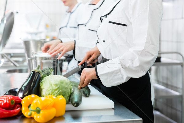 chefs preparing meals in commercial kitchen Stock photo © Kzenon