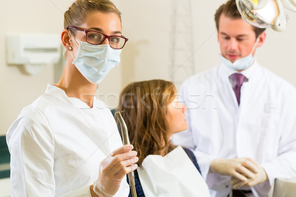 Dentista cirugía perforación dentistas mirando colega Foto stock © Kzenon