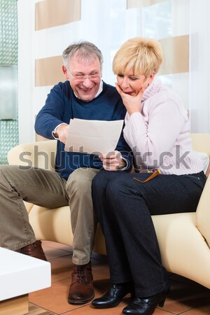 Seniors at home with tablet computer Stock photo © Kzenon