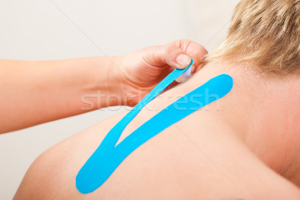 Patient at the physiotherapy with tape Stock photo © Kzenon