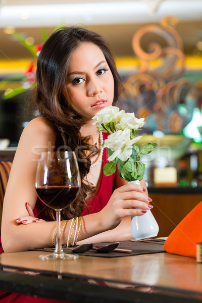 Chinese woman waiting in restaurant for date  Stock photo © Kzenon