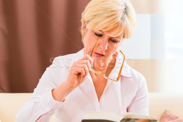 Senior reading with presbyopia book Stock photo © Kzenon