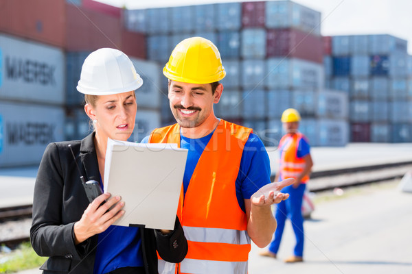 Shipping company workers in front of containers Stock photo © Kzenon