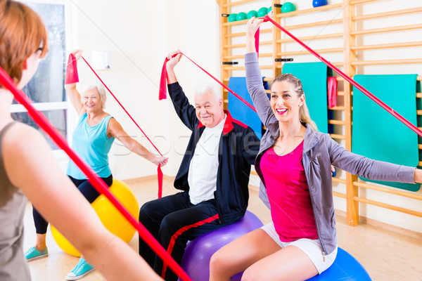 Senior people at fitness course in gym Stock photo © Kzenon
