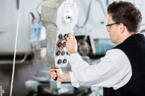 Stonemason operating stone saw Stock photo © Kzenon