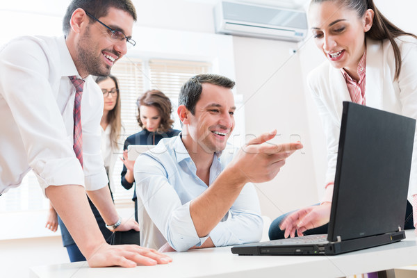 Business team reporting to boss having meeting in office Stock photo © Kzenon