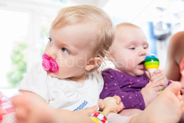 Babies with pacifier in toddler group playing with toys Stock photo © Kzenon