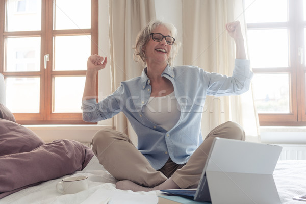 Senior business woman being excited about a success  Stock photo © Kzenon