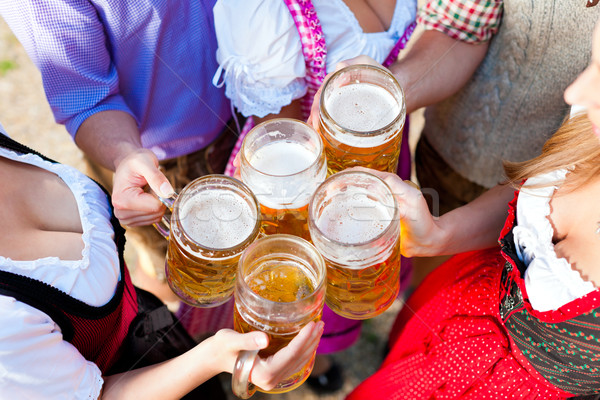 In Beer garden - friends drinking beer Stock photo © Kzenon