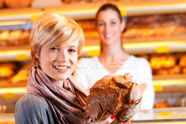 Salesperson with female customer in bakery Stock photo © Kzenon