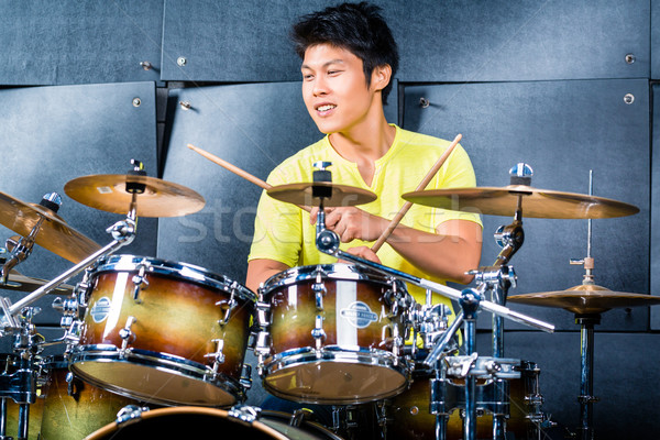 Asian musician drummer in recording studio Stock photo © Kzenon