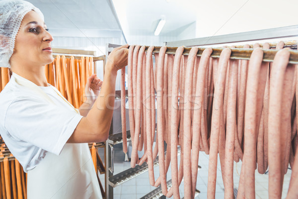Ring Sausages in rack waiting to be smoked in butchery Stock photo © Kzenon