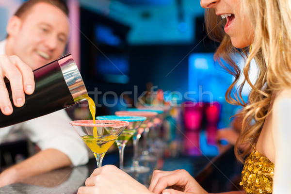 Stock photo: People in club or bar drinking cocktails