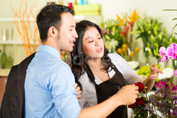 Saleswoman and customer in flower shop Stock photo © Kzenon