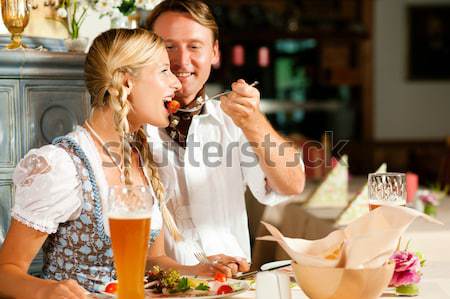 Friends eating and drinking in fast food diner Stock photo © Kzenon
