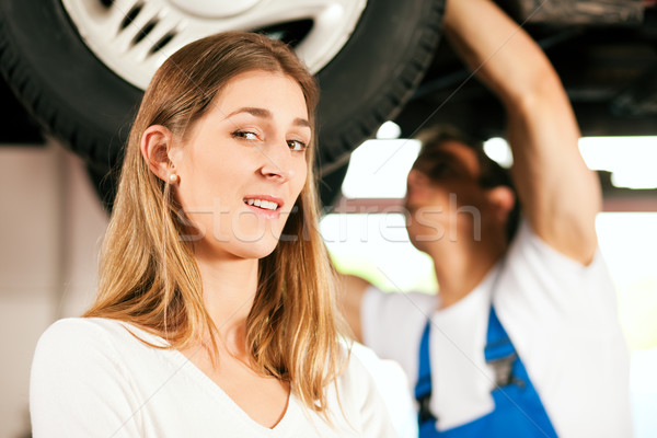 Mechanic repairing car of woman Stock photo © Kzenon