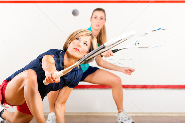 Squash sport - women playing on gym court Stock photo © Kzenon