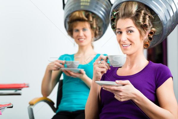 Women at the hairdresser hair being dried Stock photo © Kzenon