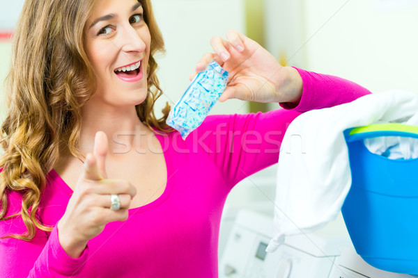 Female student in a laundry Stock photo © Kzenon