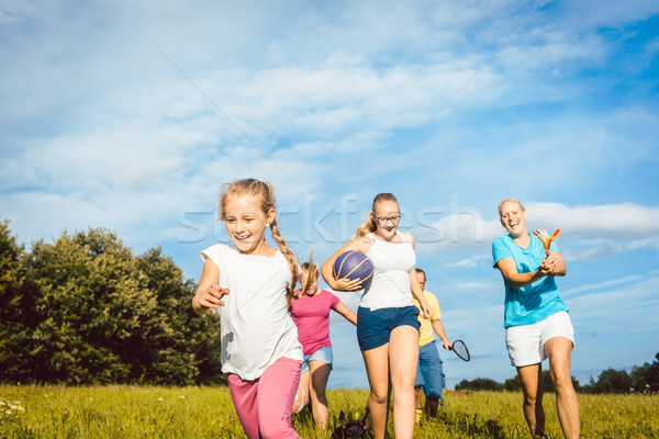 Family playing, running and doing sport in summer Stock photo © Kzenon