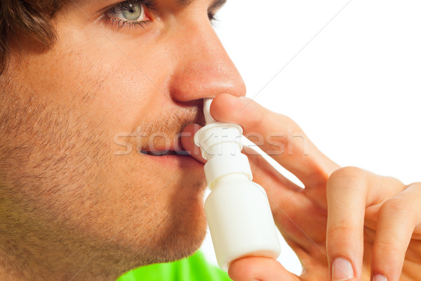 Young man with nasal spray Stock photo © Kzenon