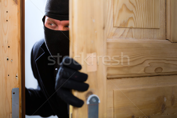 Betörés bűnözés betörő nyitás ajtó biztonság Stock fotó © Kzenon