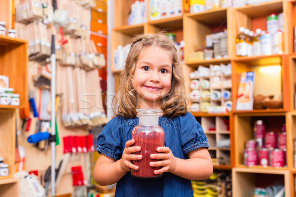 Child with color or paint pigments in store Stock photo © Kzenon