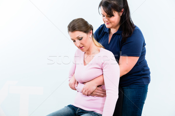 Women in First aid course practicing rescue of accident victims Stock photo © Kzenon