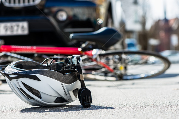 Close-up of a bicycling helmet on the asphalt  next to a bicycle Stock photo © Kzenon