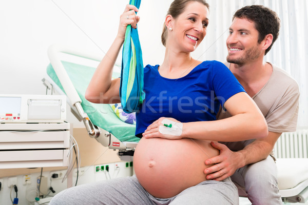 Pregnant woman and man in delivery room of hospital Stock photo © Kzenon