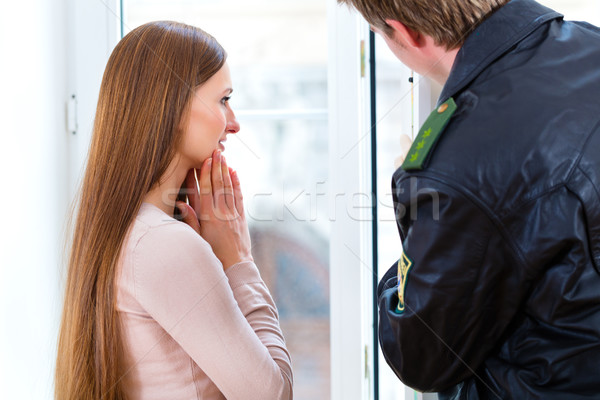 Stock photo: Police officer preserving evidence after burglary