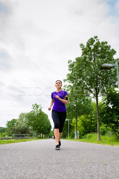 Sports outdoor - young woman running in park Stock photo © Kzenon