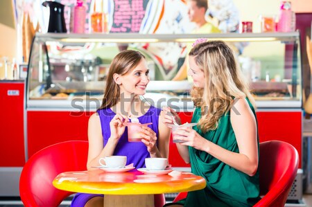 People in American diner or restaurant and waitress Stock photo © Kzenon