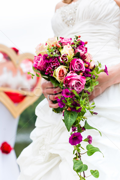 Stock photo: Bride in gown with bridal bouquet and doves