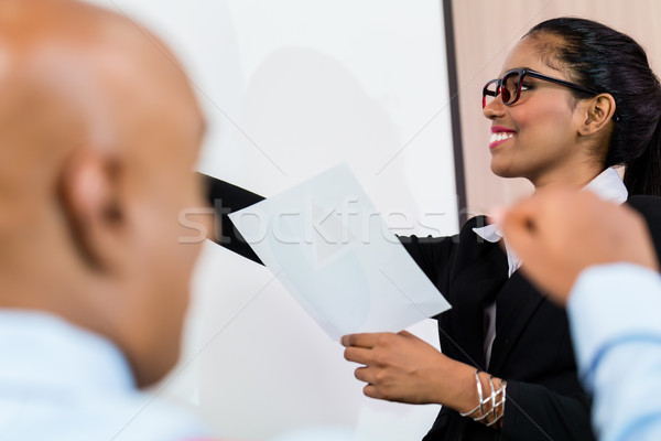 Indian woman at business presentation with team Stock photo © Kzenon