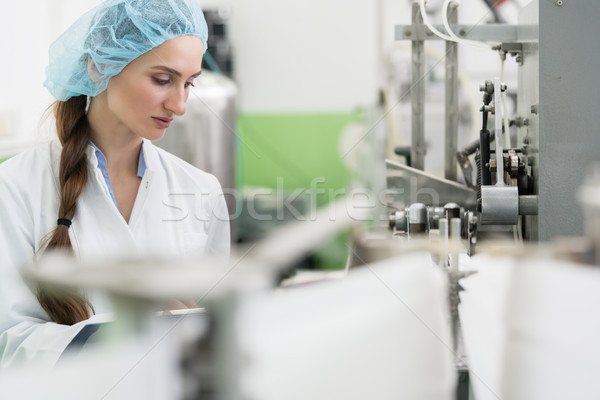 Happy woman employee working as manufacturing engineer in factor Stock photo © Kzenon