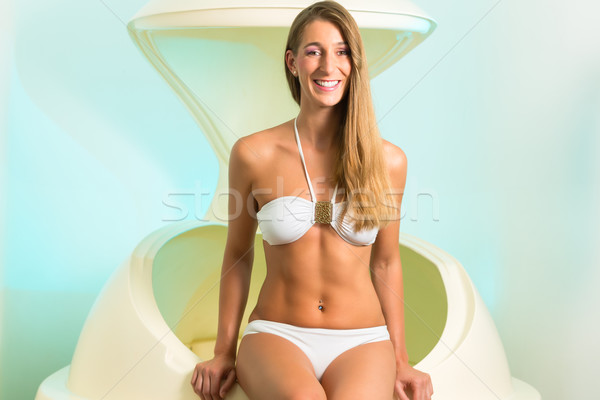 Wellness - young woman floating in Spa in tank Stock photo © Kzenon