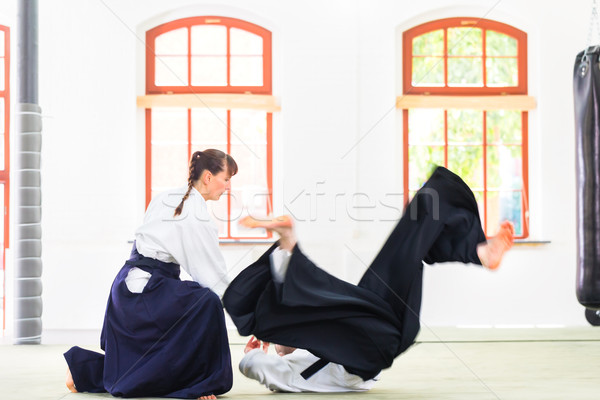 Aikido teacher and student training throwing and falling Stock photo © Kzenon
