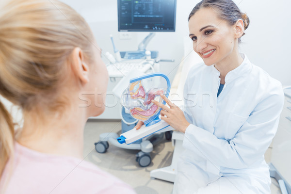 Stock photo: Childless woman in fertility clinic talking to doctor