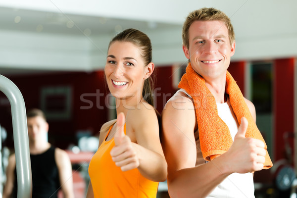 Sportive couple in gym Stock photo © Kzenon