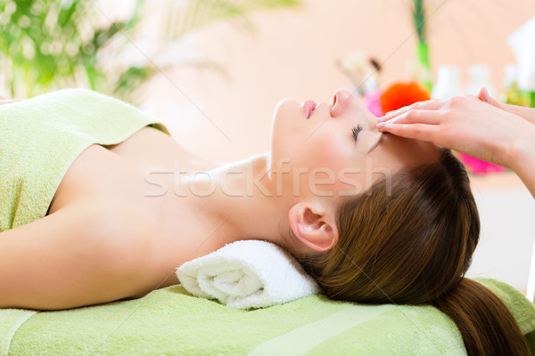 Wellness - woman getting head massage in Spa Stock photo © Kzenon