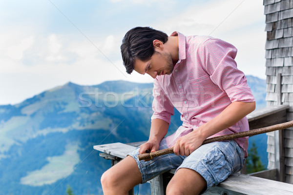 Alps - Man on mountains sitting at cabin in tirol Stock photo © Kzenon